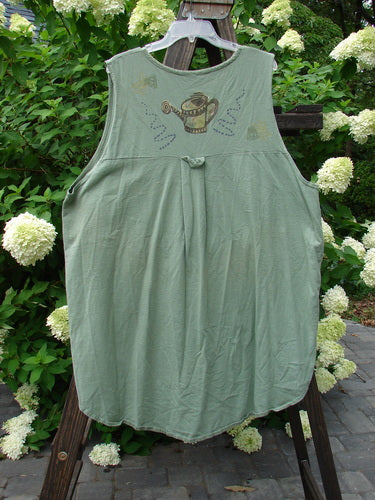 1995 Breeze Vest Water Can Dinette Green OSFA: A green vest with a water can theme paint, featuring a rounded front and back shirttail hemline, a deep V-shaped neckline, and tall rounded vented sides.
