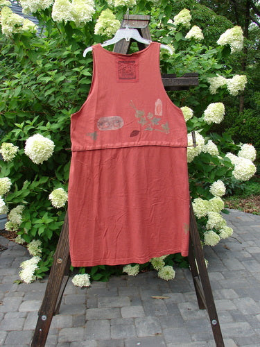 1993 Little Tree Vest Falling Leaf Red Oro OSFA displayed on a rack, featuring a deep V neckline, empire waistline, and unique snap-off lower panel with harvest-themed paint and vintage buttons.