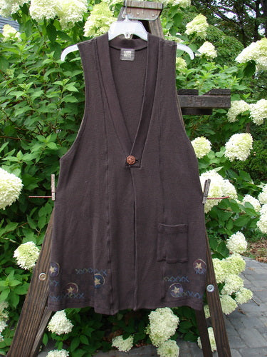 1999 Thermal A Line Vest Star Bounce Currant Size 1, hanging on a clothesline outdoors, showcasing its A-line shape, single button closure, and deep arm openings.