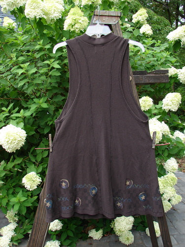 1999 Thermal A Line Vest Star Bounce Currant Size 1 displayed on a swing, featuring a single button closure, large exterior pocket, and deeper arm openings with contrasting ribbing.