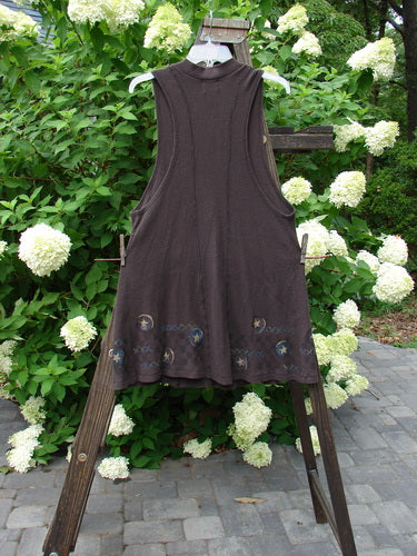 1999 Thermal A Line Vest Star Bounce Currant Size 1 displayed on a clothesline, featuring a single button closure, deeper arm openings, and a lower exterior pocket.