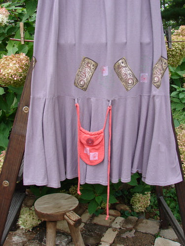 1997 Shell Fish Skirt Seahorse Sea Urchin Size 2 on a rack, featuring a full elastic waistband, deep side pockets, and a 12-inch bottom kick flounce, highlighted by a clear textured button pouch.