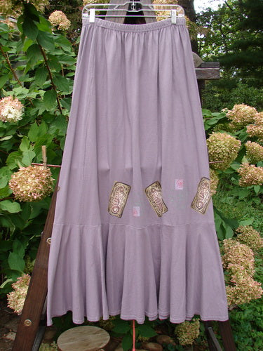 1997 Shell Fish Skirt Seahorse Sea Urchin Size 2 features a full elastic waistband, deep side pockets, and a 12-inch bottom kick flounce, displayed on a wooden rack.