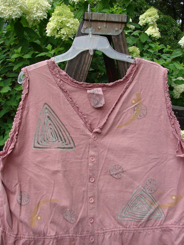 1995 Wish Vest Ocean Shell Heart Size 2 on a wooden hanger, showcasing antique lace accents, tiny front buttons, V-shaped neckline, adjustable hemline, cropped back, and whimsical ocean-themed paint.