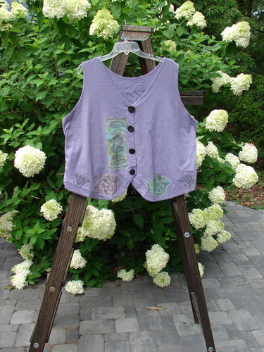 1993 The Vest Mushroom Garden Periwinkle Size 1 displayed on a wooden stand, featuring Blue Fish buttons, tuxedo-style front tails, and an upward rounded back with a heart signature patch.