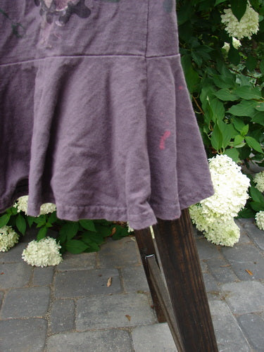 1996 Spring Laughter Skirt Vine Blossom Violet Field Size 2 displayed on a wooden stand, showcasing its full elastic waistband and detailed vine blossom theme paint.