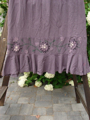 1996 Spring Laughter Skirt Vine Blossom Violet Field Size 2 displayed on a rack, showcasing its detailed vine blossom pattern and full elastic waistband for a slimming drape.