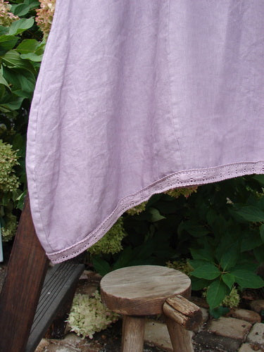 Barclay NWT Linen Lace Blooming Tunic Dress in Lavender, featuring a cross-over neckline, empire waist seam, lace hem, and scalloped three-quarter sleeves. Perfect for a spring collection. Size 2.