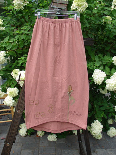 1998 Botanicals Corolla Skirt Digitalis Magnolia Size 1, featuring an upward scooped front hemline, full elastic waistband, and pocketless design, displayed on a rack.