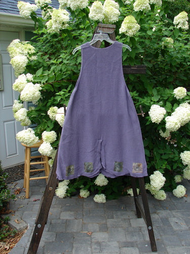 1994 Vent Vest Sweater Jumper Sea Life Periwinkle OSFA displayed on a wooden rack, showcasing its detailed hemline, three clay front buttons, and slenderizing A-line shape with a rear walking vent.