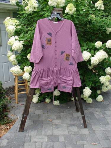 Image alt text: 1997 Belladonna Jacket with detachable pocket purses and whimsical top hat theme paint, on a rack