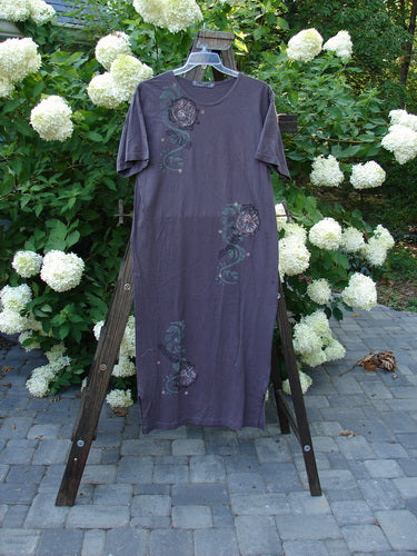 1996 Long Tea Dress Curl Rose Violet Field Size 1 displayed on a ladder with a scooped neckline, straighter shape, vibrant rose design, tapered bottom, and side vents.