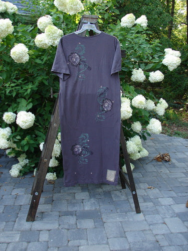 Image alt text: 1996 Long Tea Dress Curl Rose Violet Field Size 1 - A purple dress with a straighter slim shape, featuring a vibrant curl rose theme and tapered bottom line with sweet side vents.