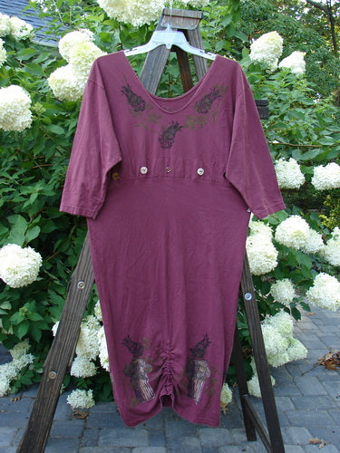1993 Deep Neck Button Dress Woodberry Roman Strings OSFA: A purple dress on a wooden stand with a deep and wide neckline, tapering shape, and empire seam button accent.