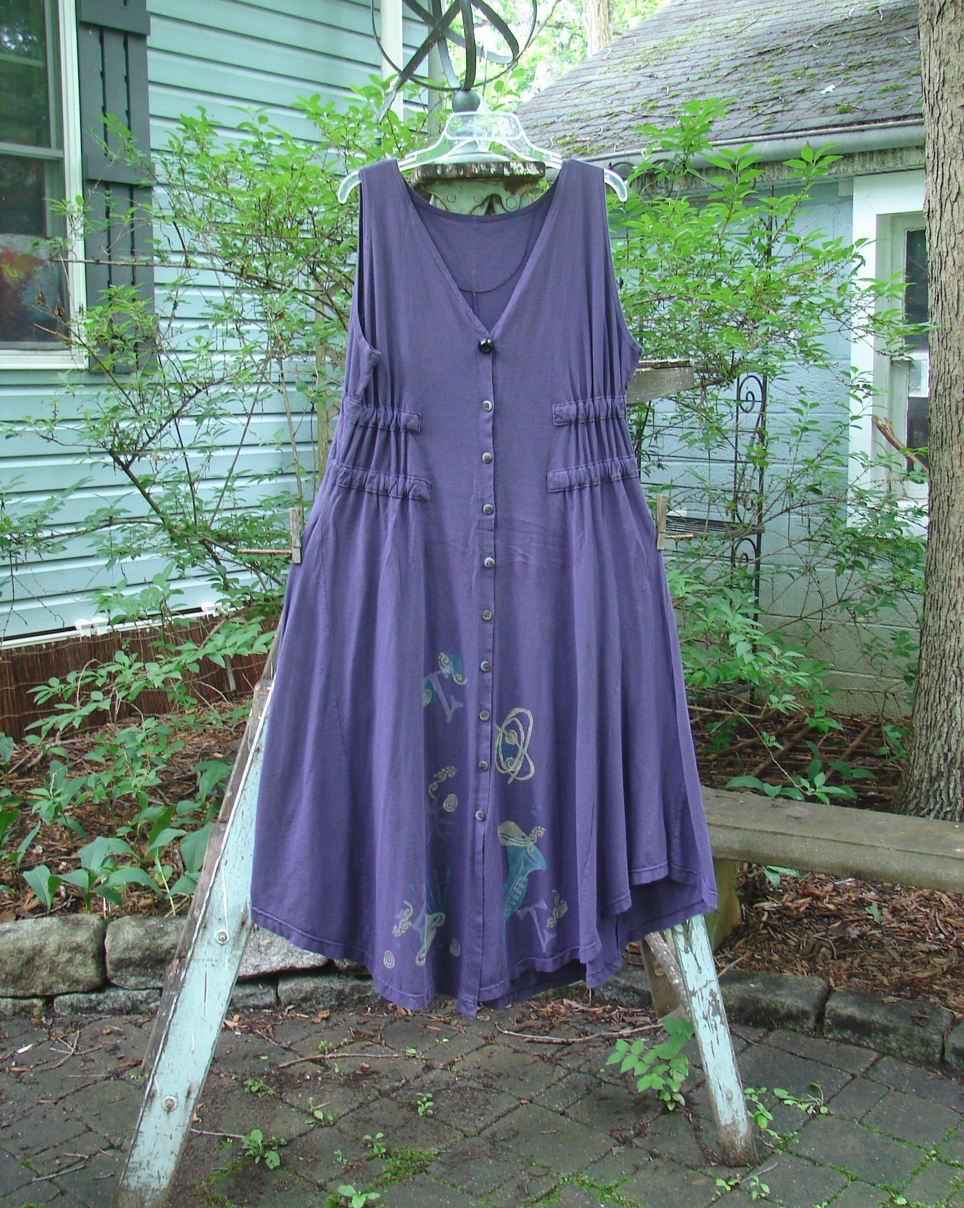 1994 Spin Jumper Mixed Purple Nuit Size 2: A purple dress on a clothes rack with a design on it.