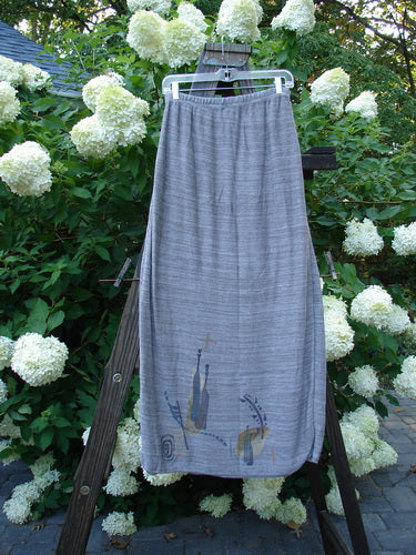 1995 Cotton Rayon Linear Column Sweater Duo Pike Dusk Mélange OSFA Size 1 displayed on a rack, showcasing the tunic's intricate stitch patterns and the skirt's elastic waist and ribbed hemline.