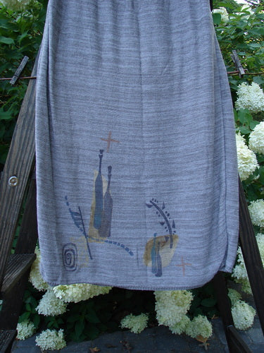 1995 Cotton Rayon Linear Column Sweater Duo Pike Dusk Mélange OSFA Size 1: A grey skirt with a picture of wine bottles and a cross, complementing the Linear Tunic Top.