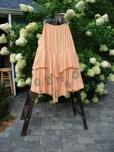 Barclay Two Story Skirt Bubbles Sherbert Size 2 displayed on a rack, highlighting its full elastic waistline, flutter edges, and unique bubble pattern. The skirt is part of the Spring Collection.