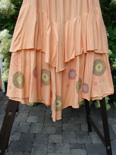 Barclay Two Story Skirt Bubbles Sherbert Size 2 displayed on a rack, highlighting its full elastic waistline, flutter-like edges, and dual-layered design.