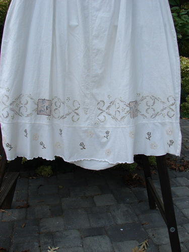 Barclay Linen Duet Skirt Tiny Floral White Size 2 with full elastic waistline, bell shape, sectional panels, front V-shaped insert, varying hemline, and tiny floral paint details.