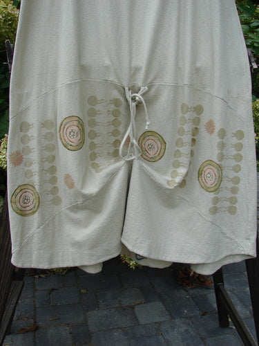 2000 Cotton Hemp Shade Skirt Bio Atom Dove Size 2 displayed on a rack, featuring a full elastic waistband and adjustable hemline with sectional horizontal panels.
