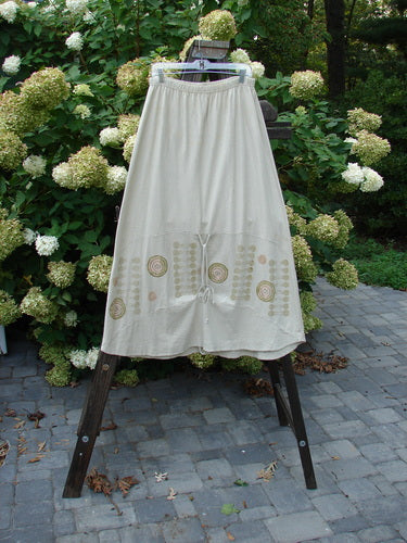 2000 Cotton Hemp Shade Skirt Bio Atom Dove Size 2 displayed on a rack, featuring a full elastic waistband, varying hemline, and sectional horizontal panels.