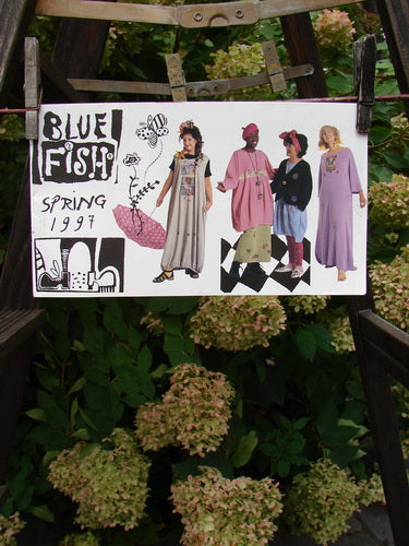 Image: A sign with different models of women, a person wearing a pink shirt, a person wearing a long dress, a close-up of a tree trunk, a group of women wearing dresses, and a close-up of a plant.

Alt text: 1997 Spring Catalog Creative Connection One Size - Blue Fish Clothing models and nature elements.