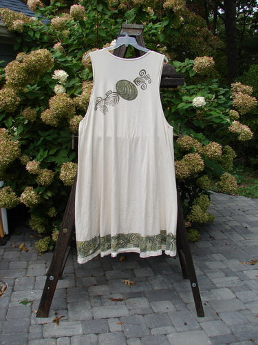 1993 Long Column Vest Feather Fern Tea Dye OSFA displayed on a swing. The vest features deeper arm openings, widening lower sweep, deep oval neckline, vertical paint, and vintage wooden-like buttons.