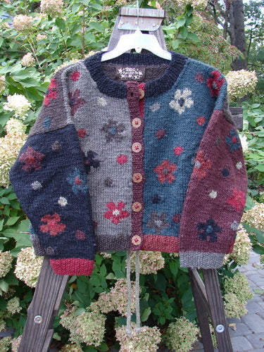 Tara Handknits Box Tie Back Cardigan Sweater Tiny Floral OSFA displayed on a swinger, showcasing its detailed colorful patterns and cozy ribbed neckline, perfect for adding a vintage touch to your winter wardrobe.