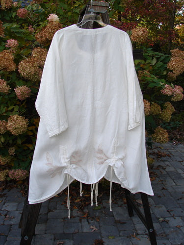 Barclay Linen Venetian High Vent Tunic Dress Tall Bud White Size 2 displayed on a hanger, showcasing its hourglass shape, wide hip and hemline, and softly squared neckline with triple draw cords.