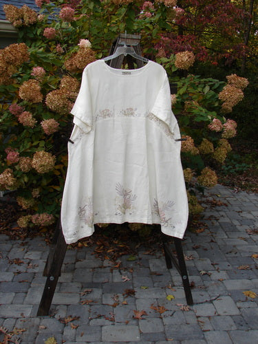 Barclay Linen Urchin Tunic Dress Undersea White Size 2 displayed on a rack, featuring a floral design, rounded neckline, A-line shape, and wide short sleeves, from Bluefishfinder.com Summer Collection.