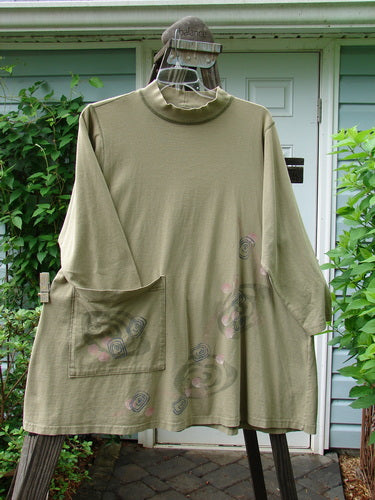 1996 Rambler Dress Follow Path Bottlecap Size 1 displayed on a hanger, featuring a ribbed mock turtleneck, A-line shape, oversized front pocket, in-seam side pocket, and exterior stitching.
