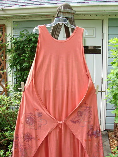 Barclay Side Panel Jumper Floral Tangerine Altered Size 2 on a clothes rack with deep rounded neckline, superior side sectional panels, and dramatic varying hemline.