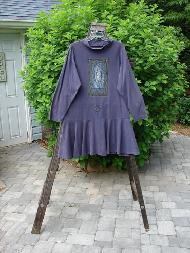 1995 Lark Dress Single Floral Bloomsbury Size 1 displayed on a swinger, featuring a mock ribbed turtleneck, dropped hip seam, and flirty flip bottom flounce, showcasing vintage Blue Fish design.