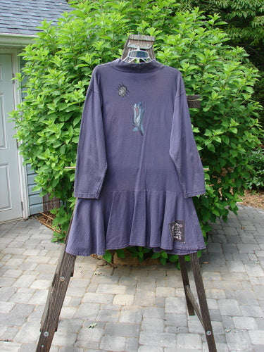 1995 Lark Dress Single Floral Bloomsbury Size 1 displayed on a swing, featuring a mock ribbed turtleneck, flouncy bottom, and Blue Fish patch.