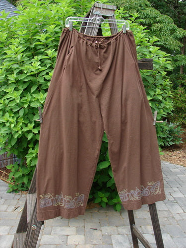 A pair of Buttonloop Pants from the 1992 Summer Collection in Bay Leaf. Features include a drawstring waistline, deep side pockets, and a longer inseam. Made from medium weight cotton.