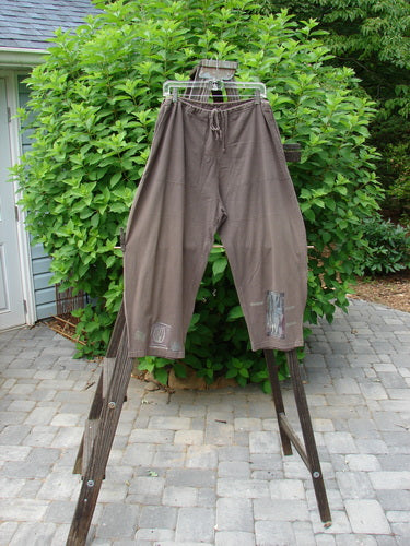 1994 Wanderer's Pant Spirit Woman Humus Size 1 displayed on a rack, featuring a full drawstring waistline, side entry front pockets, crop length, and widening rounded hip.