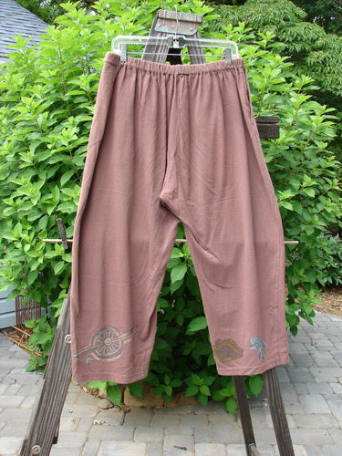 Image alt text: "Vintage 1993 Resort Crossroad Pant in Dusty Rose, size 1, on a clothesline with travel-themed paint, side entry pockets, and a cropped, tapered inseam."