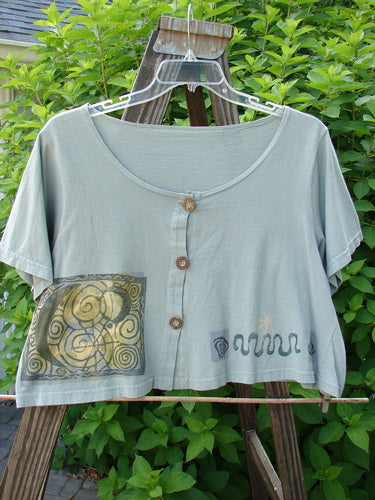 1993 Travel Top Many Moons Ocean Size 2: A shirt on a swinger with a deeply scooped neckline, lovely crop shape, and wooden accented buttons.