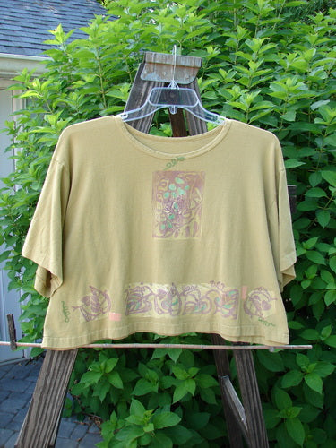 1992 Short Sleeved Crop Tee: A vintage t-shirt featuring a grape and vine theme. Perfect condition. Bust 50, Waist 50, Hips 50, Length 20.