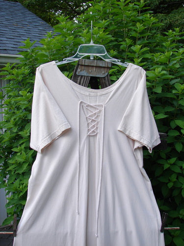 1994 Loop Dress Magic Garden Tea Dye Smaller OSFA: A white shirt on a swinger, featuring a sweeping A-lined shape, dual cord lacings, and a super flared hemline.