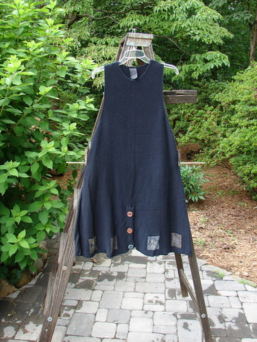 1994 Vent Vest Sweater Jumper Sea Life Black OSFA with intricate clay buttons and detailed hemline, featuring a slimming A-line shape and rear walking vent, displayed on a swinger.