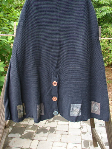 1994 Vent Vest Sweater Jumper Sea Life Black OSFA: A black skirt with three unique clay buttons, slender A-line shape, detailed hemline, and rear vent, perfect for smaller frames.
