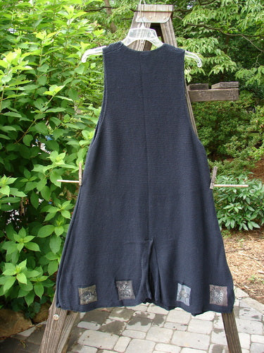 1994 Vent Vest Sweater Jumper Sea Life Black OSFA displayed hanging on a clothesline. The vest features 3 clay buttons, detailed hemline with whimsical nature paint, and a rear walking vent.