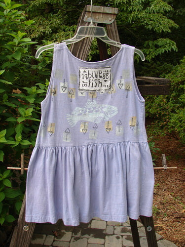 1990 Tiny Tier Top Fish Clover Tiny OSFA displayed on a swing, featuring a fish theme, deep rounded neckline, and bottom flounce, perfect for vintage Blue Fish clothing enthusiasts.