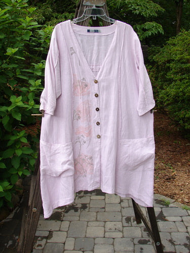 Barclay Linen Double Tie Back Jacket Sprig Pink Cloud Size 0 on a swinger, showcasing its deep V-neckline, A-line sweep, and exterior vertical stitchery.