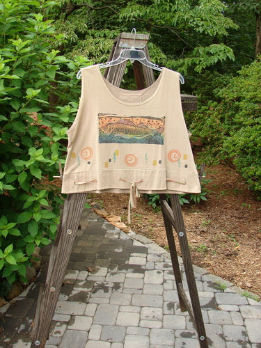 1992 Camisette Top Fish Wheat OSFA displayed on a rack, featuring a scooped wider neckline, swingy hemline with button holes, hand-dyed silk ribbon, vintage fish and water theme paint, and signature patch.
