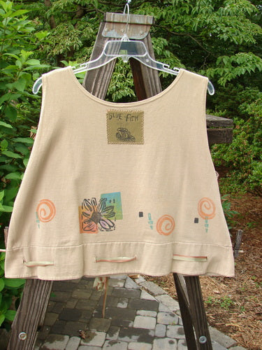 1992 Camisette Top Fish Wheat OSFA on a wooden hanger, featuring a scooped neckline, swingy hemline, button holes, orangy freckles, and a signature Blue Fish patch on the back.