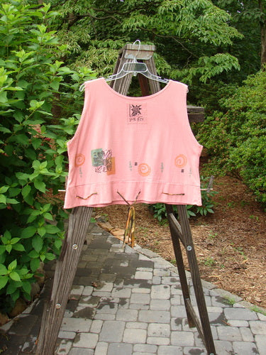 1992 Camisette Top Fish Pink Clover OSFA displayed on a hanger outdoors, showcasing its scooped neckline, swingy hemline with button holes, and vintage fish theme paint.