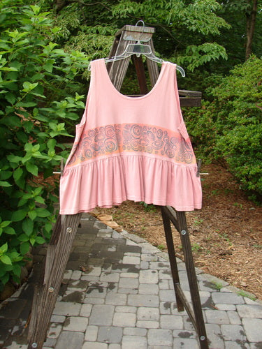 1992 Peplum Top Rose Border Pink Clover OSFA displayed on a clothesline, showcasing its baby doll style with a downward yoked waist seam and gathered bottom flounce.
